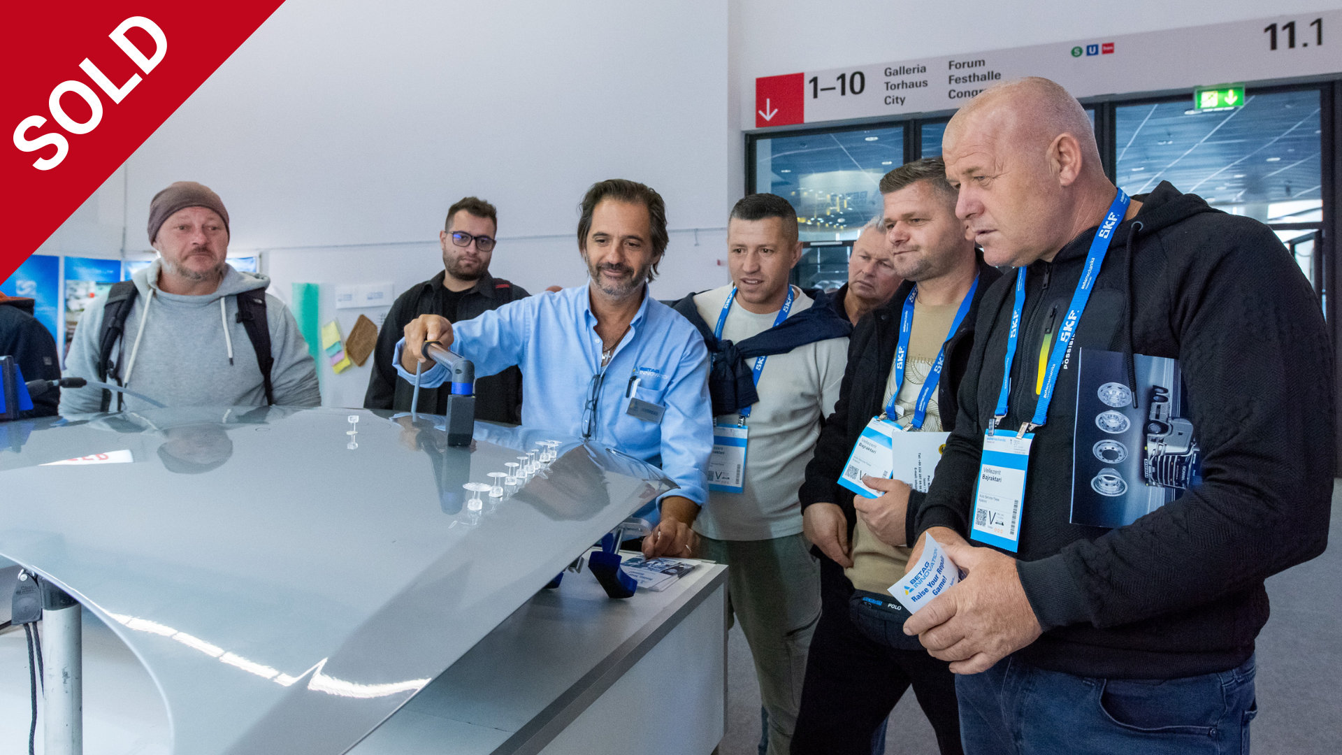 Automechanika visitors with lanyards